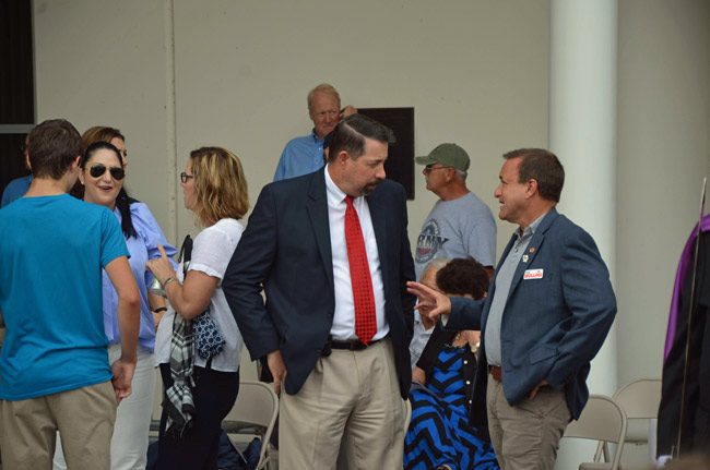 Craig Coffey, center, blames newly elected Commissioner Joe Mullins, right, for a climate of attacks that's leading to his offer to resign. (© FlaglerLive)