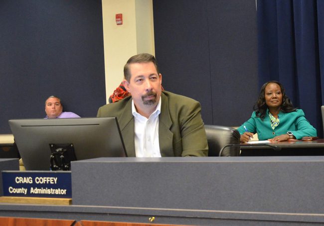 Craig Coffey, with Sally Sherman, his deputy, right, and IT Director Jarrod Shupe, left. (c FlaglerLive)