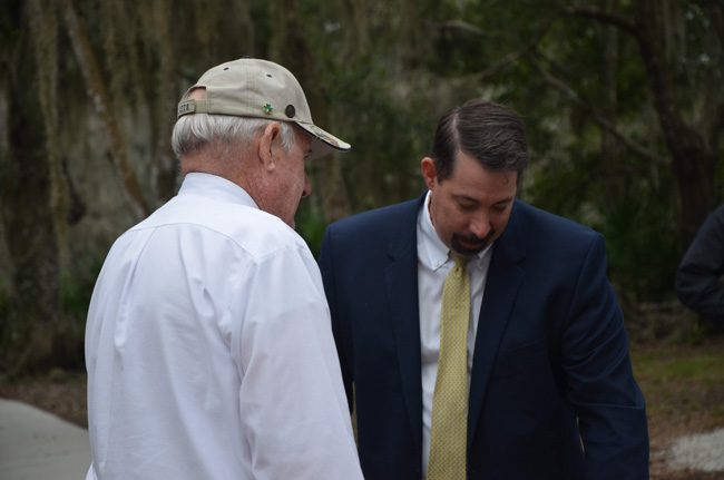 County Administrator Craig Coffey's job is teetering. County Commissioner Dave Sullivan, left, suggested Craig might be convinced to resign. A Jan. 14 meeting is set to decide his future, but meanwhile constitutional officers and the county's public sector unions are all but deciding it, outflanking the commission. (c FlaglerLive)