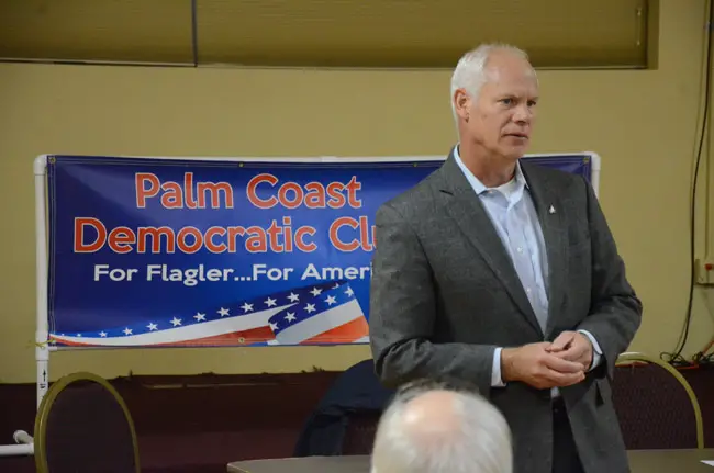 Bob Coffman, an airline pilot, during an appearance at the Palm Coast Democratic Club in January. (© FlaglerLive)
