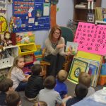 Colleen Conklin, when she was a Flagler County School Board member, reading to children in 2017. (© FlaglerLive)