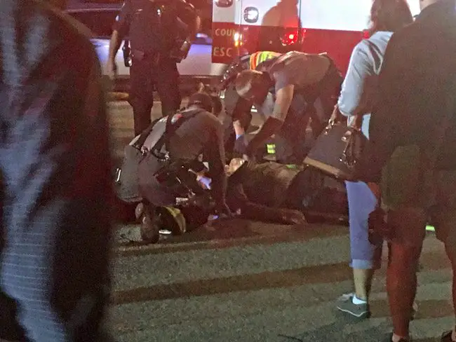The scene on A1A and South 7th Street in Flagler Beach this evening as paramedics worked on a man struck by a vehicle on State Road A1A. (© FlaglerLive)