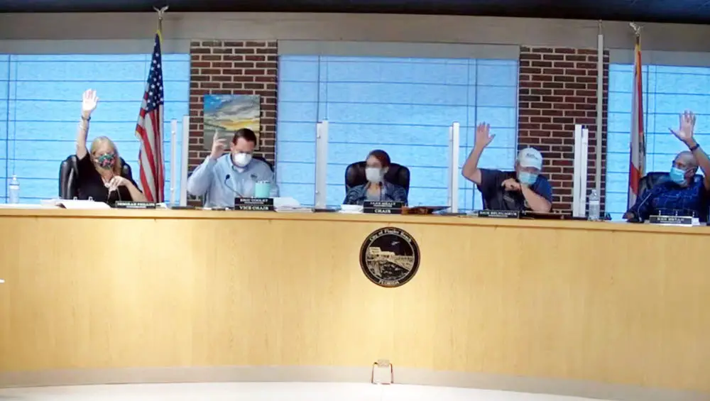 A super-majority clearly showed the Flagler Beach City Commission favoring returning the tax rate to rollback next year in a show of hands at last week's budget workshop. But there's been surprises since. (© FlaglerLive via YouTube)