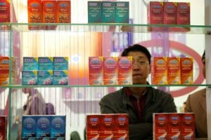 A Chinese visitor looks at condoms at the Beijing International Sex Supplies Exhibition.