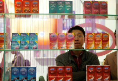 A Chinese visitor looks at condoms at the Beijing International Sex Supplies Exhibition.