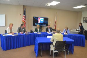 Conklin and her colleagues during the last selection process for a superintendent. She will have to recuse herself from all such discussions in this round. (© FlaglerLive)