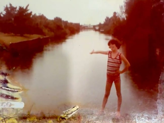 Colleen behind the family house on East Moody Boulevard, around the block from the bar her parents owned. 