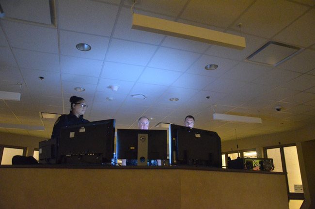 Flagler County Sheriff Rick Staly, center, in the control room at the county jail last summer. (© FlaglerLive)