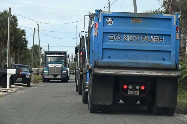 Convoys of dump trucks had thickened traffic on Flagler Beach's South Central Avenue for three days. (© FlaglerLive)