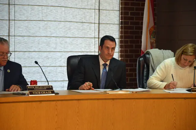 Flagler Beach Commissioner Eric Colley, center, did not get the support he was hoping for when he proposed looking into contributing money to the school district's school resource deputies' budget. (© FlaglerLive)
