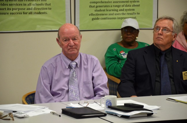 Jerry Copeland, left, Bill McGuire, and behind McGuire, Jerusha Logan, a community member who's been critical of the district's search process. Click on the image for larger view. (© FlaglerLive)