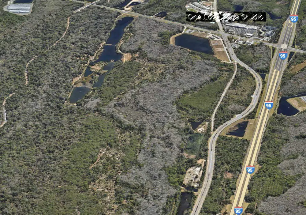The Coquina Shores acreage seen from the north toward the south, with I-95 to the right. The development will sprawl alongside the Graham Swamp trail. (Google Earth)