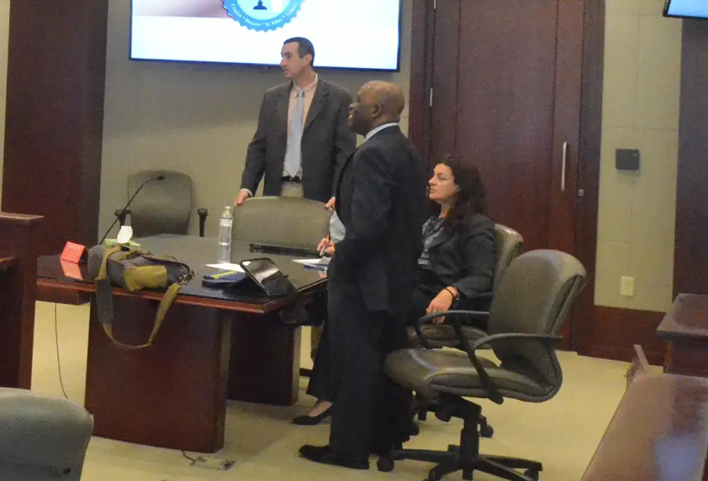 Assistant State Attorney Jason Lewis, left, Assistant State Attorney Tammy Jaques and Assistant Regional Counsel Junior Barrett are asking Circuit Judge Margaret Hudson to delay the case of Cornelius Baker. (© FlaglerLive)