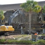 The demolition of the school district's Corporate One property in 2016. The land has sat vacant since. (© FlaglerLive)