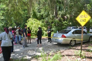 Police sealed off Espanola Road the morning of the shooting, as a crowd gathered and occasionally flared. (© FlaglerLive)