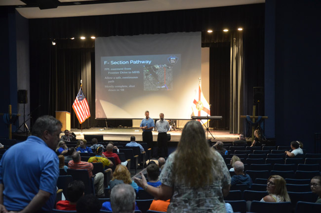 Palm Coast Construction Manager Carl Cote and Senior Planner Jose Papa took heat toniught as Matanzas area residents of the F-Section were critical of a planned 10-foot bike and foot path along a powerline easement through the heart of the F Section. (© FlaglerLive)