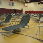 Courts to cots: what the Rymfire Elementary gymnasium will look like by the time county employees set up the place as the special-needs shelter run by the Flagler Health Department. Above, the set-up ahead of Hurricane Irma in 2017. (© FlaglerLive)