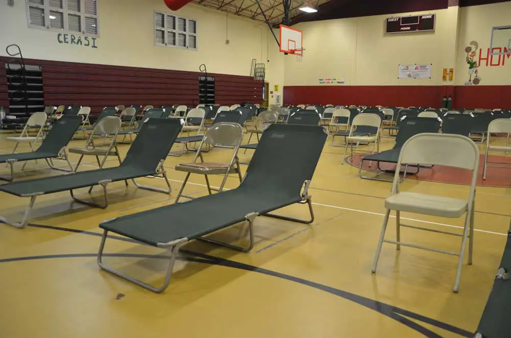 Courts to cots: what the Rymfire Elementary gymnasium will look like by the time county employees set up the place as the special-needs shelter run by the Flagler Health Department. Above, the set-up ahead of Hurricane Irma in 2017. (© FlaglerLive)