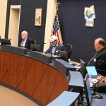 County Commissioner Andy Dance, in the foreground, thought he had the votes for a compromise on the county's budget, but a motion by Donald O'Brien at the far end of the dais carried the evening in another 3-2 surprise. (© FlaglerLive)
