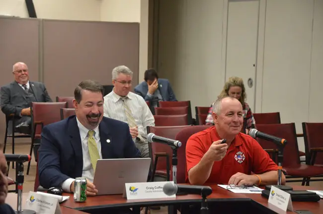 Flagler County Fire Rescue’s Jamie Burnsed, a battalion chief, right, led a discussion before the County Commission this afternoon on using drones in public safety and beyond, with County Administrator Craig Coffey. (© FlaglerLive)