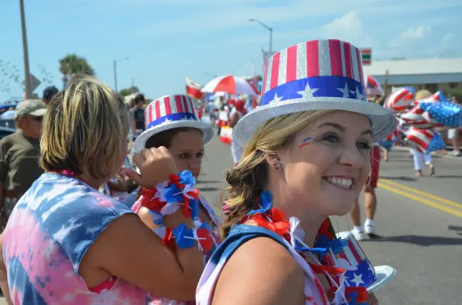 Courtney Machay of Palm Coast was among the celebrants lining A1A Thursday in Flagler Beach. Click on the image for larger view. (© FlaglerLive)