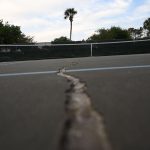 One of several dangerous cracks running through the tennis courts at Belle Terre Park. The city's Parks and Recreation department says the whole park's facilities need a rebuild, including the swimming pool. (© FlaglerLive)
