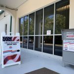 The state's crackdown on mail ballots has been quite effective. In 2020, supervisors of elections could leave drop boxes unattended, operate them 24 hours a day, and locate them wherever they chose, as was the case with the Flagler County Supervisor of Elections' drop box at the Government Services Building, above. That changed in 2021, when the Florida legislature passed a law forbidding unattended boxes, which then required supervisors to spend money they did not have to ensure that the boxes were supervised. They reduced available hours and locations of drop boxes as a result. (© FlaglerLive)