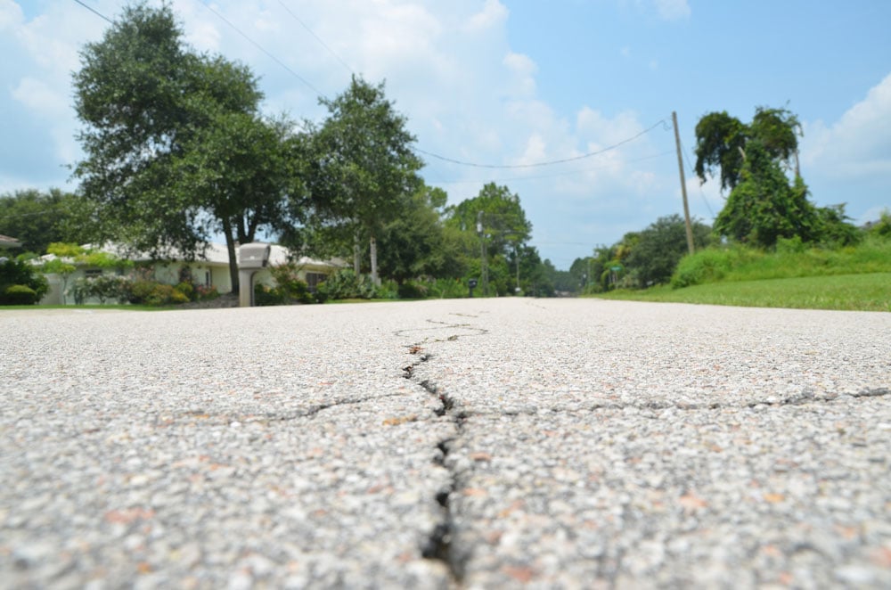 Palm Coast's roads are cracking. (© FlaglerLive)