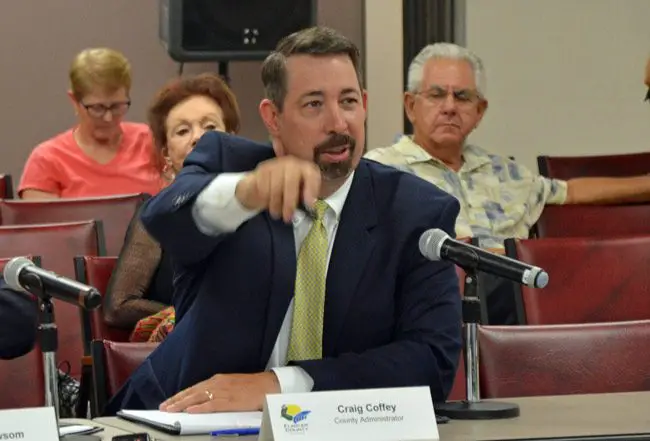 Don't blame him for being in the driver's seat: Most county commissioners have been incapable of giving County Administrator the clear direction he's sought on taxes in two successive budget hearings, so he's filling in the blanks. (© FlaglerLive)