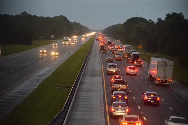 A crash with injuries stalled traffic on I-95 north just past the Palm Coast Parkway intersection this evening at sundown--not what travelers fleeing south Florida, ahead of Hurricane Matthew, wanted to see. (© FlaglerLive)