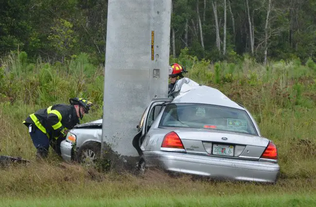 The Ford wrapped itself around the high-power utility pole off U.S. 1. (© FlaglerLive)