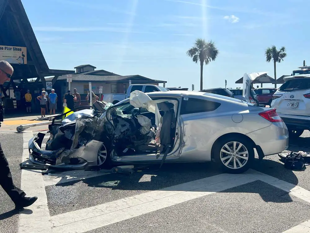 The Honda in the crosswalk across from the Flagler Beach Pier after this morning's head-on collision. (© FlaglerLive)