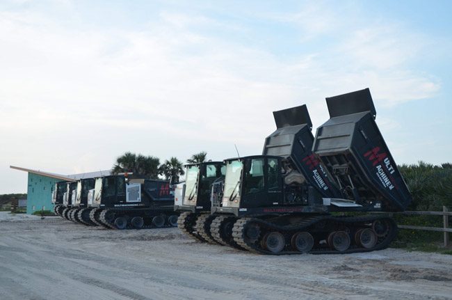 The county-operated crawler trucks that dump sand along the shore. (© FlaglerLive)