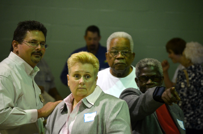 You don't want to be at the receiving end of Bunnell City Commissioner Daisy henry's pointing finger. From left, School Board member Andy Dance, Youth and Carver Center Director Cheryl Massaro, former School Board member Jim Guines, and Henry, together before the re-dedication of Carver Gym last Saturday. (© FlaglerLive)