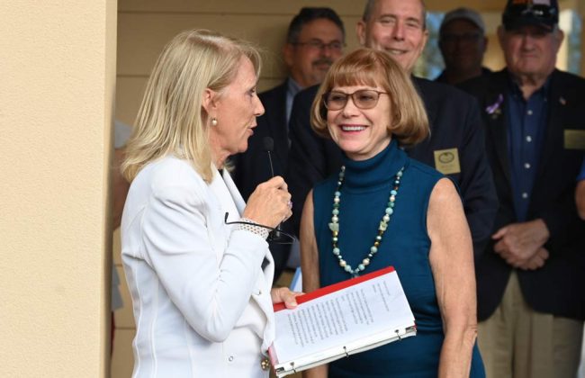 Nancy Crouch, left, and Sam Perkovich, who, as head of the Palm Coast Arts Foundation, had green-lighted the Turtle Trail project. (© FlaglerLive)
