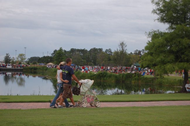 Crowds gathering in central Park in 2010, when Palm Coast held its first fireworks show--actually, it was Flagler Broadcasting's show. (© FlaglerLive)