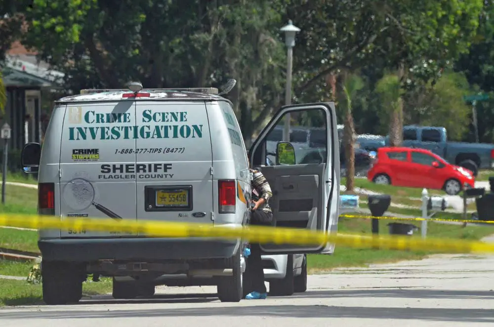 The Flagler County Sheriff's Crime Scene Investigation unit in front of 20 Blare Drive in Palm Coast nearing noon today, as it investigated the early-morning homicide there. (© FlaglerLive)