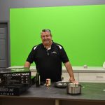 Curtis Ceballos in the studio portion of the Invisacook manufacturing plant in Bunnell. Ceballos developed the Invisacook induction cooktop stove five years ago. This week, Time named it one of the best inventions of 2023. (© FlaglerLive)