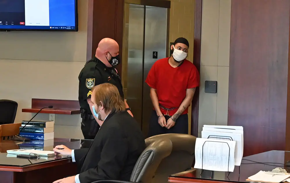 Marion Gavins Jr., right entering the courtroom this morning before his plea and sentencing. (© FlaglerLive)