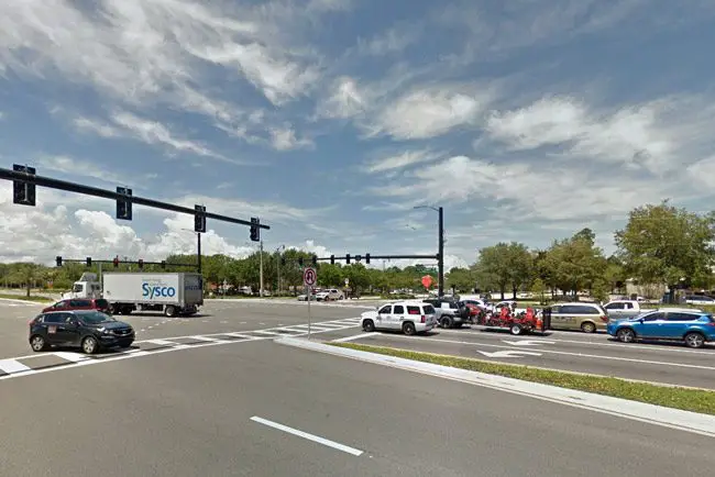 A 59-year-old cyclist was killed in a collision with a car while crossing Palm Coast Parkway Sunday night, though Parkway traffic had the green light.
