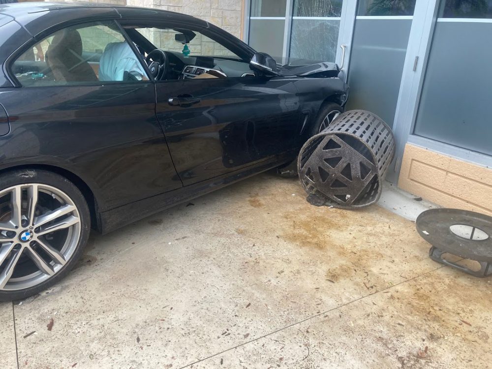 The car broke a restaurant window and dented the wall. (Flagler Beach Fire Department)