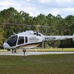 The Dan Newlin Bell 505 helicopter during one of its many visits to Flagler County. It has been acquired by the Flagler County Sheriff's Office and will have new colors and a new N-Number, tailored after Sheriff Rick Staly's dispatch number. (© FlaglerLive)