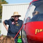 Dana Morris showing FireFlight to children at the Flagler County airport in 2018. (© FlaglerLive)