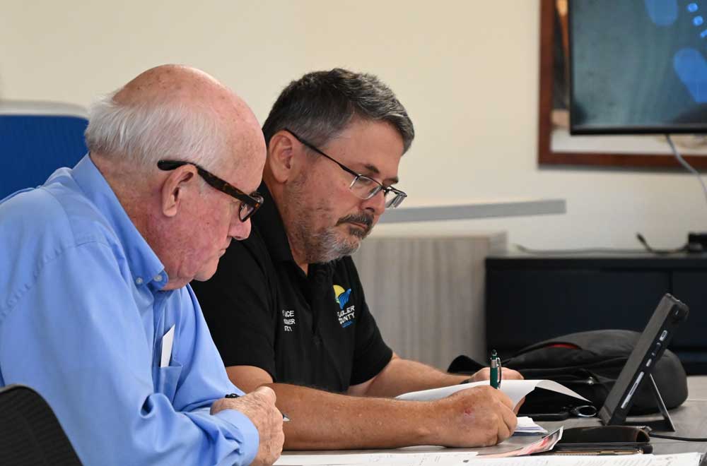 Flagler County Commissioner Andy Dance, right, keeps discovering that he and his colleagues--in this case, Dave Sullivan--aren't necessarily on the same page when it comes to rules of decorum and procedures. (© FlaglerLive)