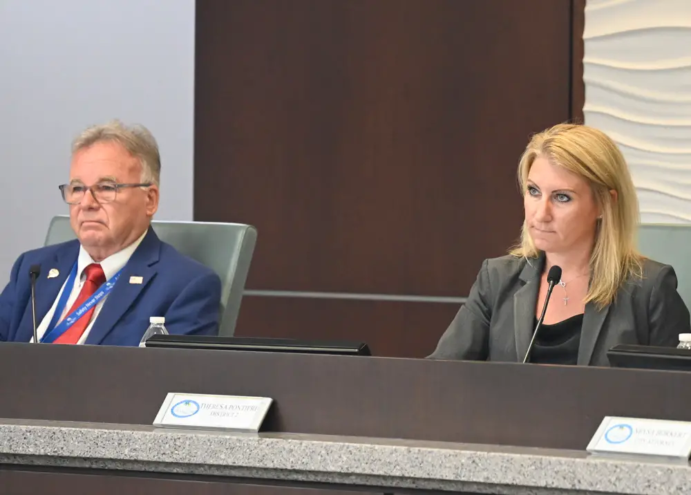 Palm Coast City Council members Ed Danko and Theresa Pontieri have led the way in turning residents' flooding issues into a city priority. (© FlaglerLive)