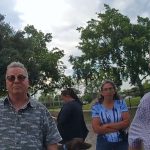 Palm Coast City Council member Ed Danko and Sandra Gay, a former corrections deputy, speaking with a Flagler County Sheriff's deputy investigating the dog-biting incident at Holland Park on April 13. (© FlaglerLive via FCSO)