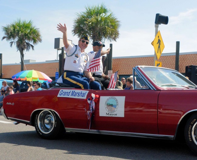  Chapter 86 Commander and Fabulous 4th Festival "Stars and Stripes" Parade Grand Marshall Raymond A. Parker, accompanied by Staff Sergeant (Ret.) Tavares Richardson, during Saturday's parade in Flagler Beach. See below for details. 