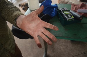 Dave Puckett shows how black his hand gets after petting his dog at the dog park, as he did on April 3. click on the image for larger view. (c FlaglerLive)