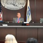 Palm Coast Mayor David Alfin, center, spent considerable political capital in defending the city's budget and tax rate for next year. He won passage of the budget on 4-1 votes. (© FlaglerLive)