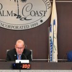 Palm Coast Mayor David Alfin called for a nearly quintupling of the mayor's and council members' salaries this evening. Two council members joined him. Eddie Branquinho, right, dissented. (© FlaglerLive)